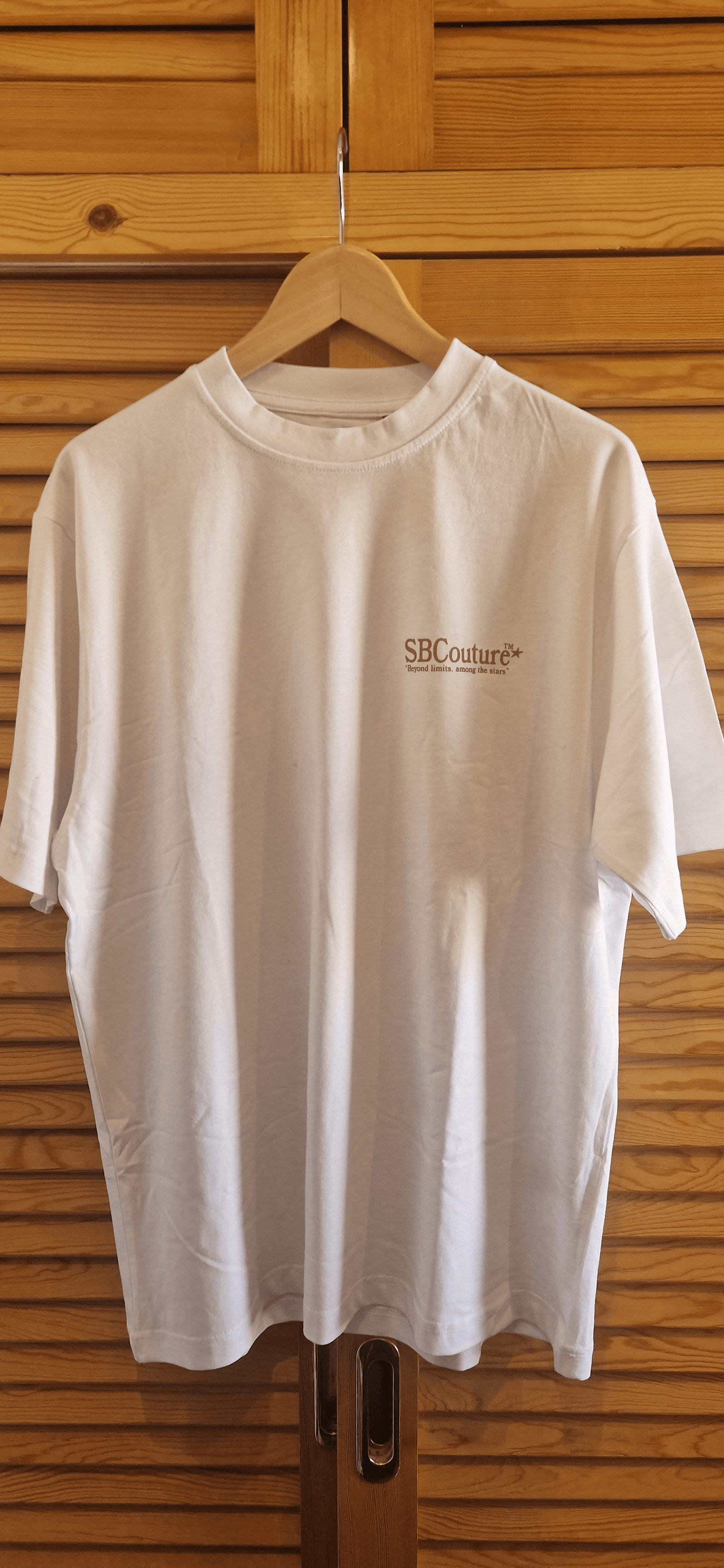 Starboy Couture SBC 'Heaven Made' Tee – white oversized t-shirt with palm-themed back graphic and clean SBCouture front.